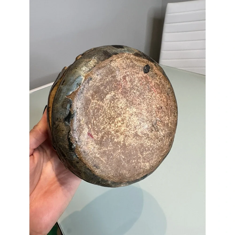 antique stone vase‎ with ornament in the form of fish